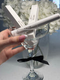 Brow Sculpt tube and boxes in a coupe glass